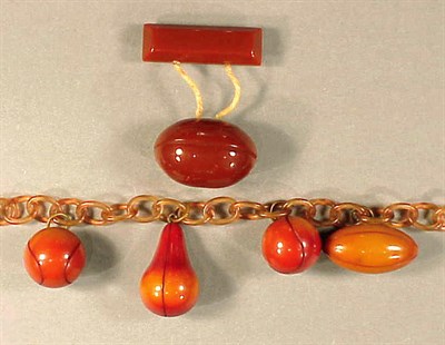 Lot 473 - Bakelite and Celluloid Bracelet The chain...