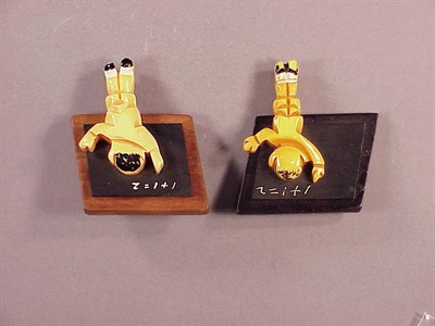 Lot 475 - Two Bakelite and Wood Broochs Each depicting a...