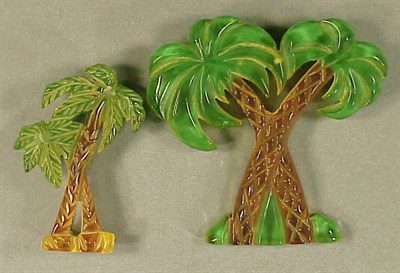 Lot 441 - Two Bakelite Brooches Each depicting two palm...
