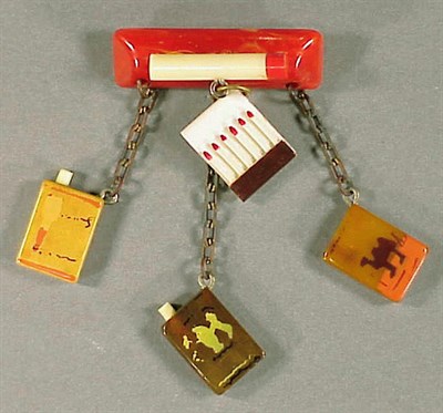 Lot 478 - Bakelite and Celluloid Brooch Depicting a bar...