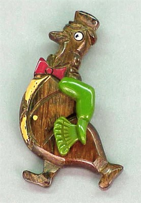 Lot 414 - Bakelite and Wood Pivoting Brooch Depicting a...