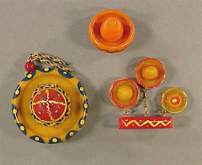 Lot 438 - Bakelite Brooch Depicting a bar suspending...