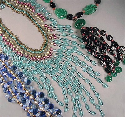 Lot 244 - Three Carved Glass Leaf and Bead Necklaces...