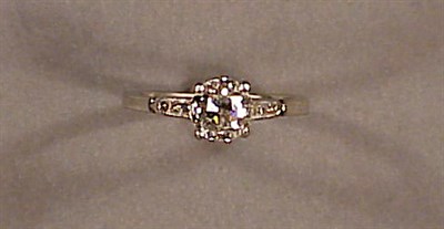 Lot 386 - Diamond Engagement Ring Platinum, centered by...