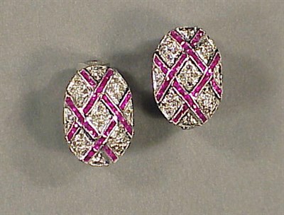 Lot 497 - Pair of Ruby and Diamond Earclips 14 kt. white...