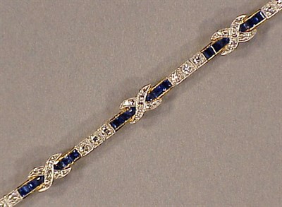 Lot 615 - Diamond and Sapphire Line Bracelet 18 kt....