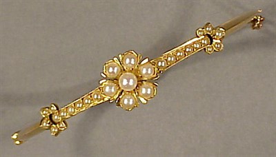 Lot 107 - Gold and Cultured Pearl Bangle Bracelet 14 kt....