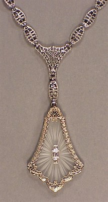 Lot 51 - Gold Filigree and Carved Rock Crystal Pendant...