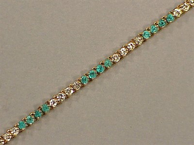 Lot 288 - Diamond and Emerald Line Bracelet 14 kt....