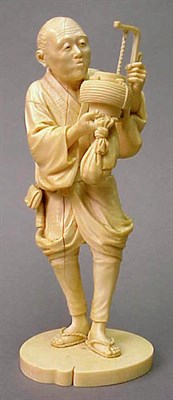 Lot 116 - Ivory Figure of a Man with Lantern Meiji...