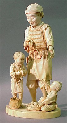 Lot 103 - Sectional Ivory Group of a Farmer with Two...