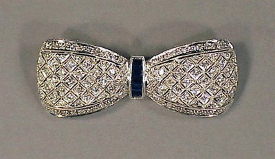 Lot 568 - Diamond and Sapphire Bow Pin 18 kt. white gold,...