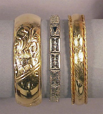 Lot 95 - Three Gold Bracelets 14 kt. yellow and white...
