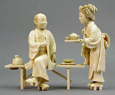 Lot 189 - Japanese Ivory Group of a Teahouse Waitress...