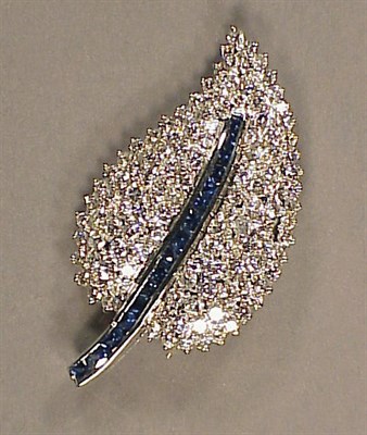 Lot 565 - Diamond and Sapphire Leaf Pin 18 kt. white...