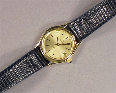 Lot 402 - Lady's Gold Quartz Wristwatch The black lizard...