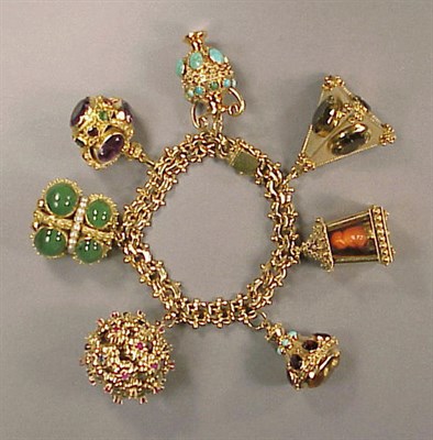 Lot 425 - Gold and Multicolored Stone Charm Bracelet The...