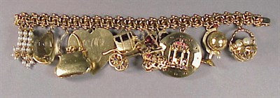 Lot 489 - Gold Charm Bracelet 14 kt. yellow gold, the...