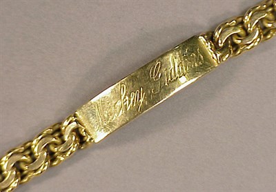 Lot 133 - Gold Identification Bracelet The 18 kt. yellow...