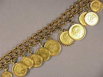 Lot 304 - Gold Coin Charm Bracelet The 14 kt. yellow...