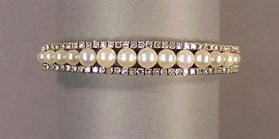 Lot 310 - Cultured Pearl and Diamond Bangle Bracelet 14...