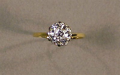 Lot 145 - Gold and Diamond Cluster Ring 14 kt. yellow...