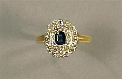 Lot 509 - Sapphire and Diamond Cluster Ring 14 kt....
