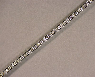 Lot 590 - Platinum and Diamond Bracelet The straight...