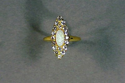 Lot 272 - Opal and Diamond Ring 14 kt. yellow gold, the...