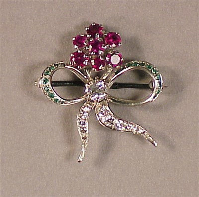Lot 576 - Diamond and Ruby Flower Pin 14 kt. white gold,...