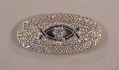 Lot 566 - Diamond and Sapphire Pin 14 kt. yellow gold...