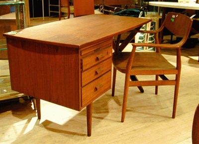 Lot 145 - Danish Teak Desk The shaped rectangular top...