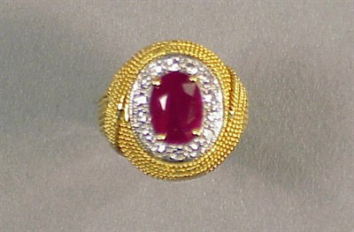 Lot 632 - Gold, Ruby and Diamond Ring The 18 kt. yellow...