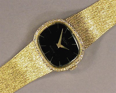 Lot 406 - Gold and Diamond Wristwatch 14 kt. yellow gold,...