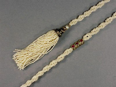 Lot 307 - Seed Pearl Sautoir The woven, twisted strand...
