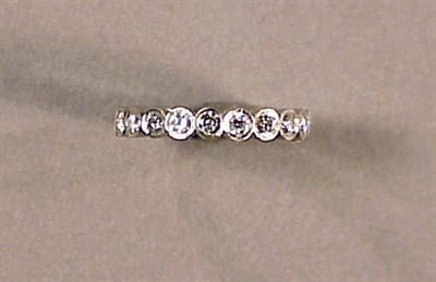 Lot 589 - Platinum and Diamond Wedding Band Continuously...