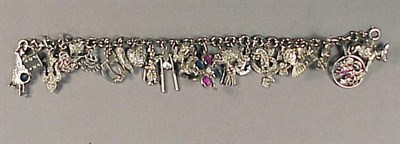 Lot 550 - Platinum and Diamond Charm Bracelet Platinum,...