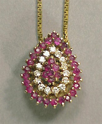 Lot 101 - Gold, Ruby and Diamond Pendant and Chain 14 kt....