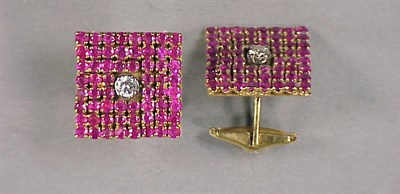 Lot 328 - Pair of Gold, Diamond and Ruby Cufflinks 14 kt....