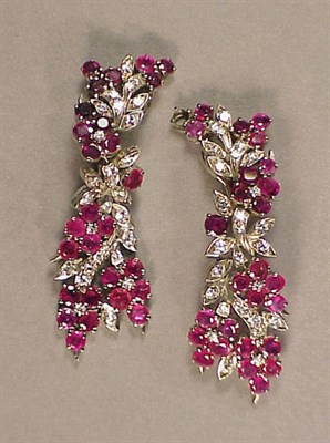 Lot 575 - Pair of Ruby and Diamond Earclips 14 kt. white...