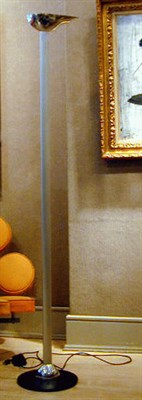 Lot 206 - Metal Floor Lamp The ovoid shade raised on a...