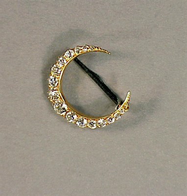 Lot 267 - Gold and Diamond Crescent Pin 14 kt. yellow...