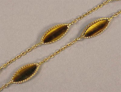 Lot 420 - Gold and Tiger's Eye Necklace 18 kt. yellow...