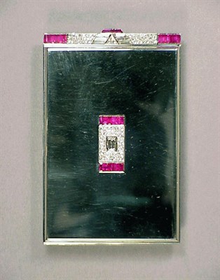 Lot 334 - Gold, Diamond and Ruby Compact 18 kt. white...