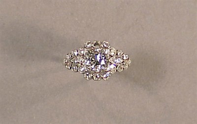 Lot 558 - Diamond Engagement Ring Platinum, centered by...