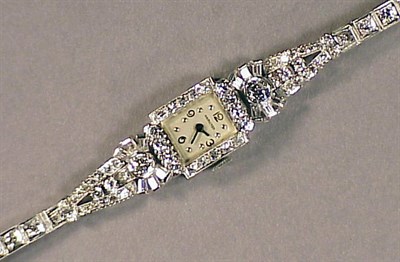 Lot 552 - Lady's Diamond Wristwatch The white gold band...