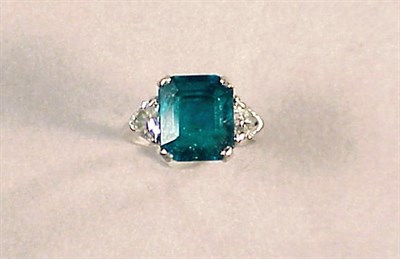 Lot 644 - Emerald and Diamond Ring Platinum, centered by...