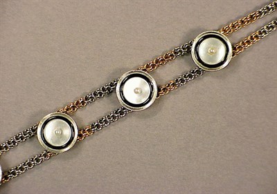 Lot 52 - Gold Bracelet The 14 kt. red and white gold...