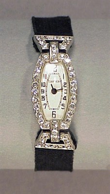 Lot 315 - Lady's Diamond Wristwatch The black grosgrain...