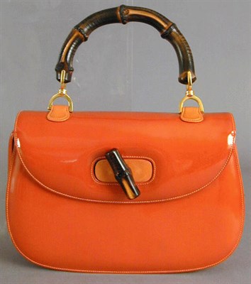 Lot 975 - Gucci Orange Patent Leather Bamboo Handle...